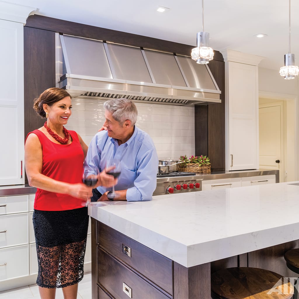 Couple standing in their kitchen