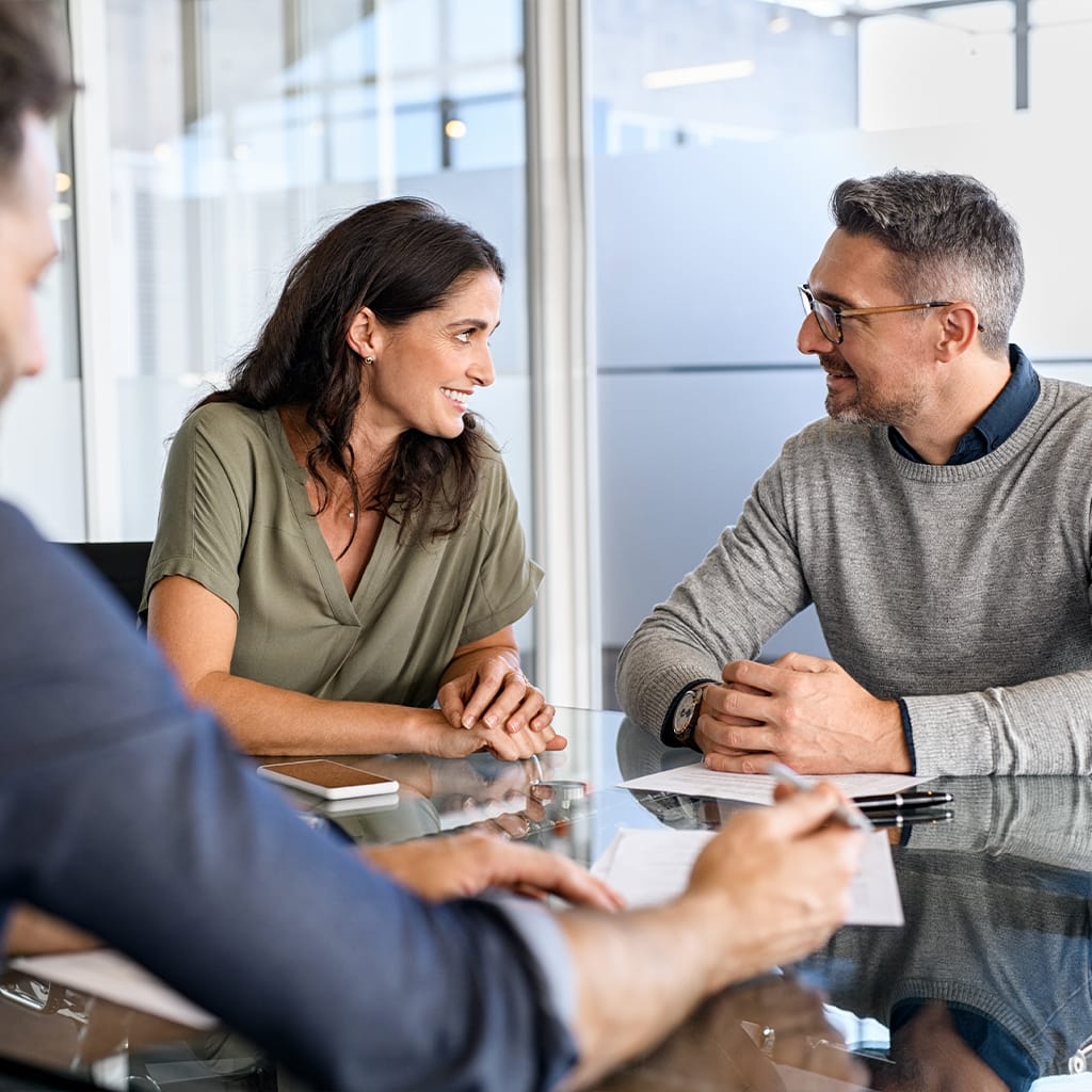 Image of man and woman discussing a financial plan at a meeting