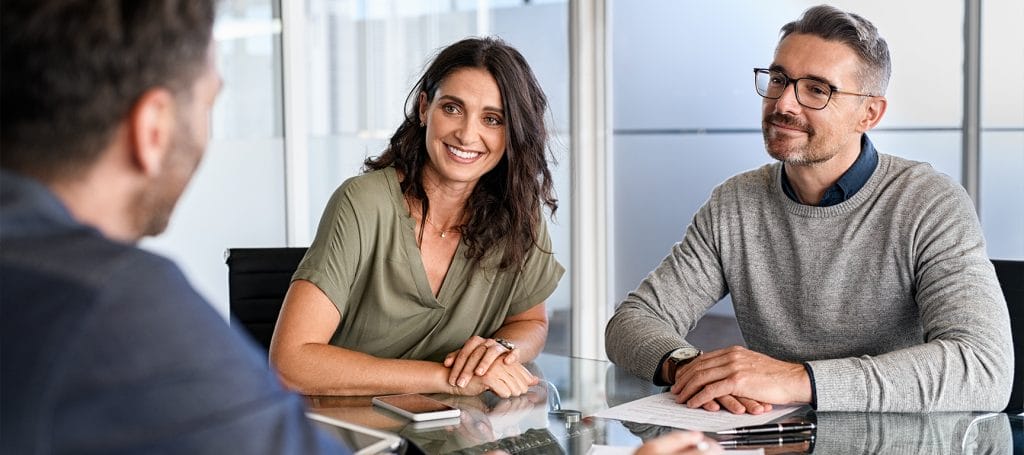 Image of a couple meeting with an advisor | Lamb Financial®