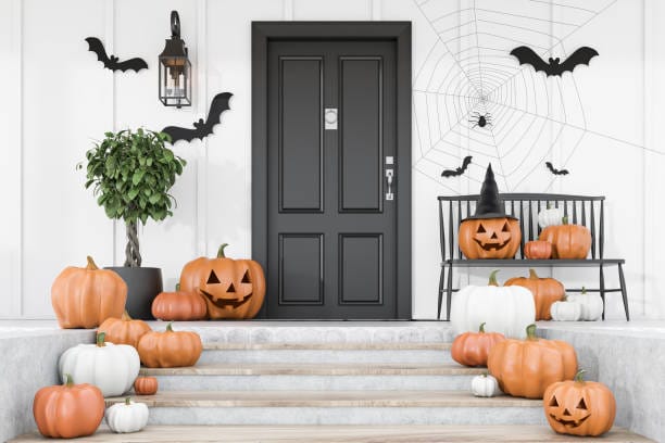 Porch with Halloween Decorations that Include Jackolanterns and bats