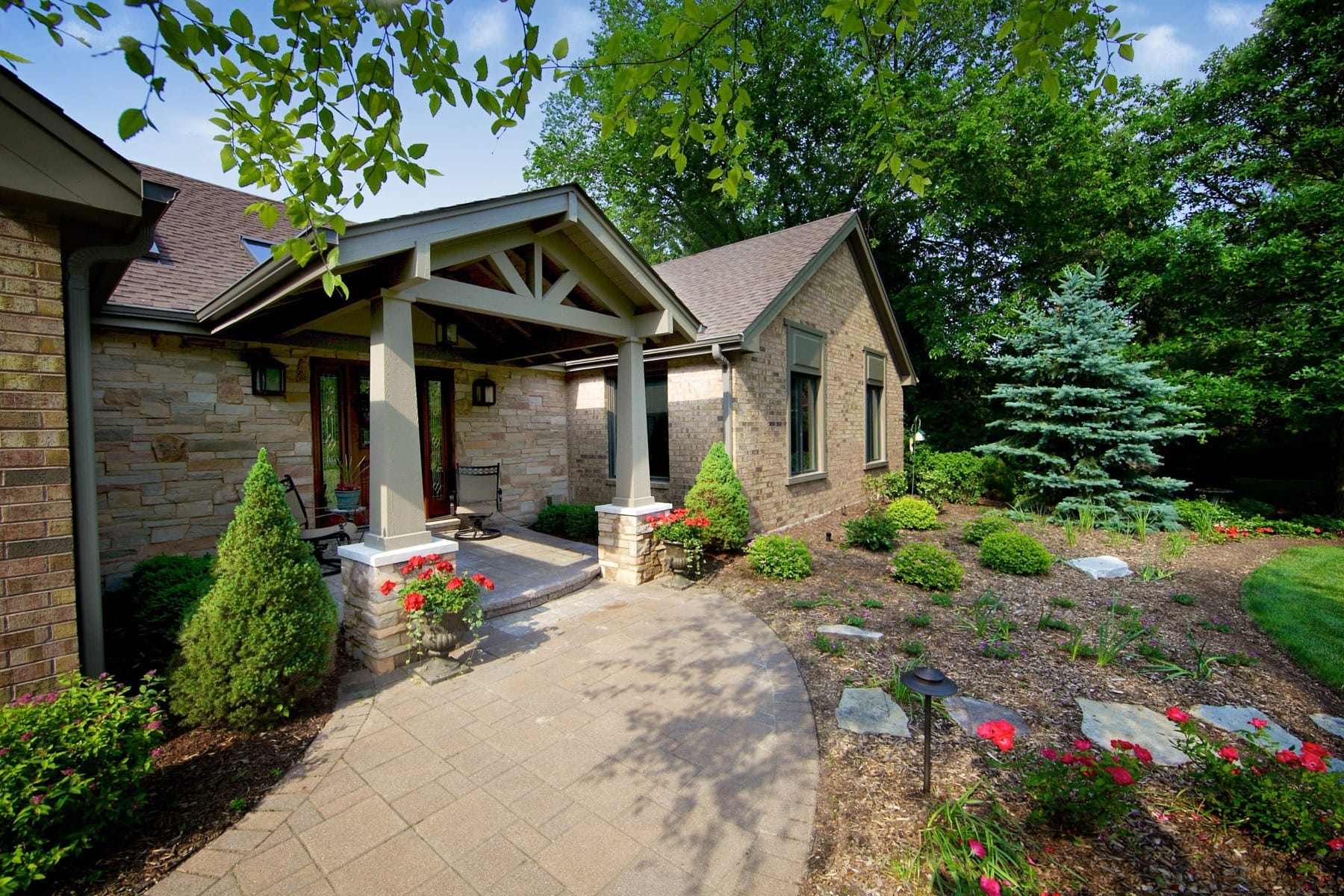 Exterior Portico Addition with Beams and Natural Stone
