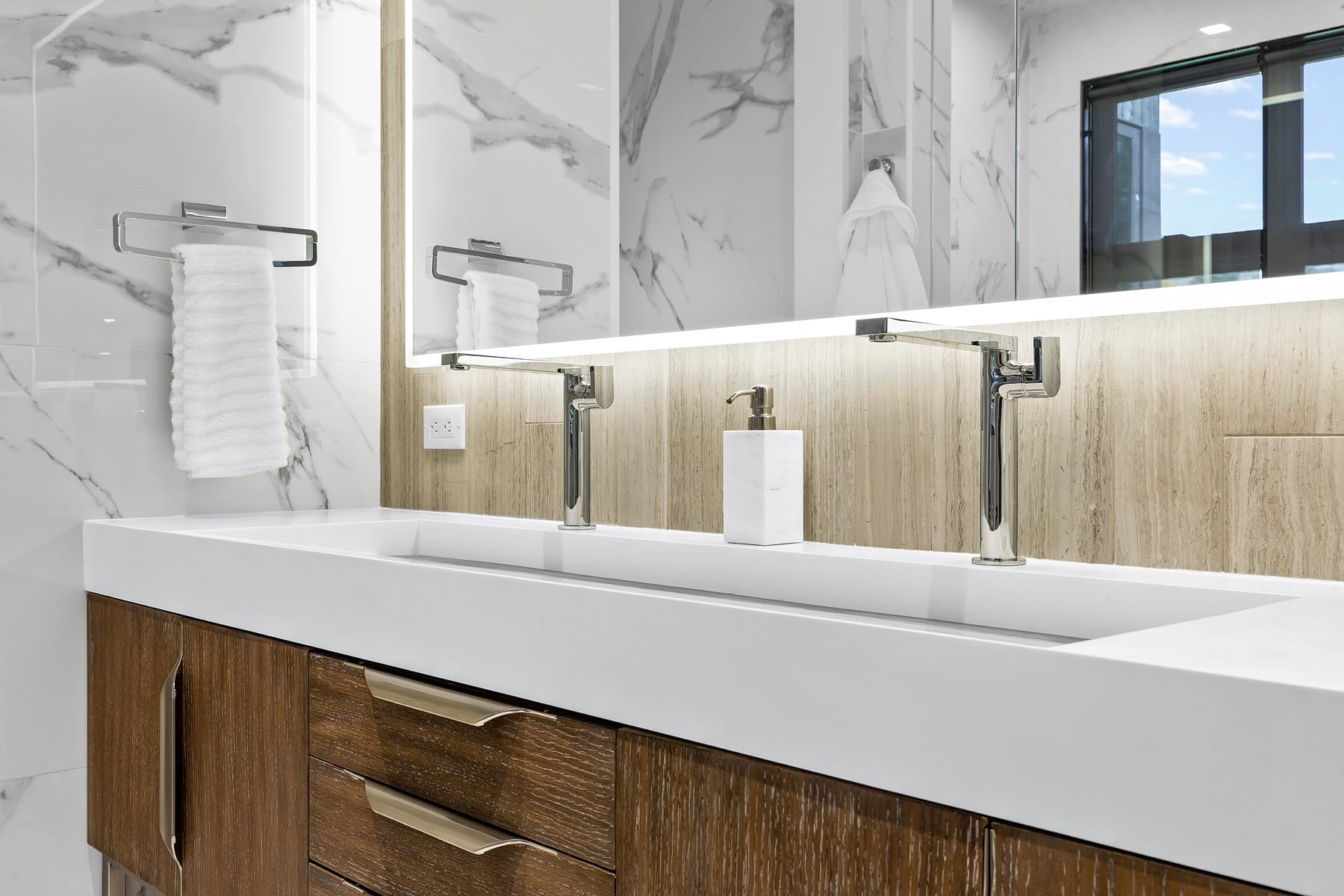 Two Faucets with an Extra Long Single Sink Basin