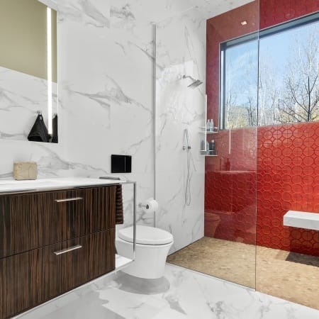 Floating Toilet and Pebble Shower Floor Tile