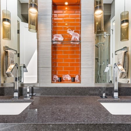 Orange Subway Tile Accent Backsplash Behind Double Vanity