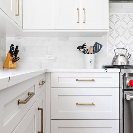 White Shaker Cabinets with Gold Drawer Pulls