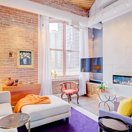 Exposed Brick Walls with Built-In Electric Fireplace