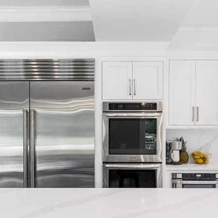 White Shake Cabinets and Stainless Steels Appliances
