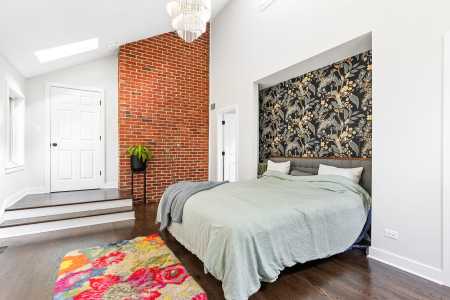Bedroom with Custom Cut-Out and Exposed Brick
