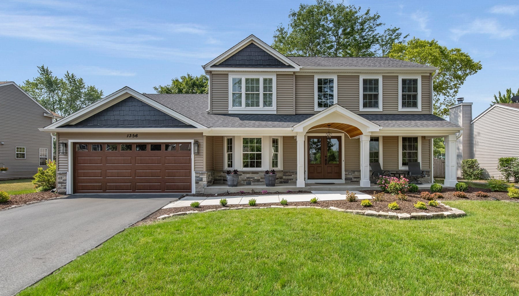 Craftsman Style Wooden Garage Door Stained in Rich Honey