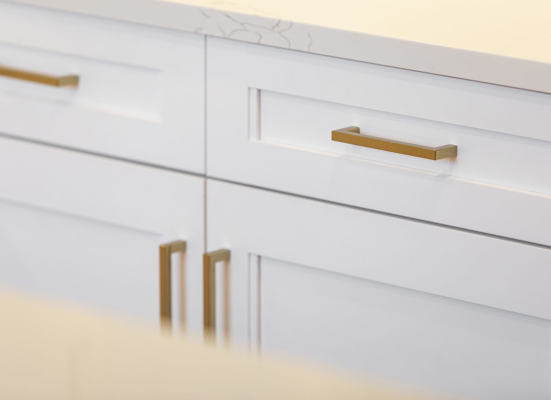 Gold Drawer Pulls on White Cabinets
