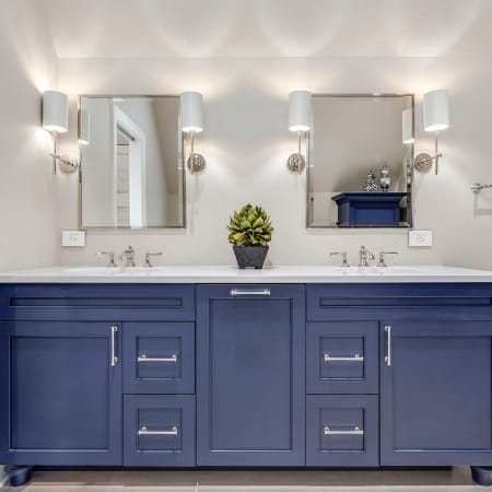 Blue Double Vanity with Mirrors and Sconces